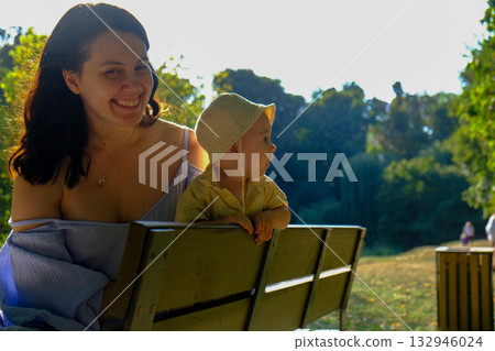 Mother and Baby Enjoying a Sunny Day in the Park Mother and Baby Enjoying a Sunny Day in the Park 132946024