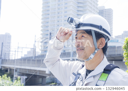 Worker wearing a full harness 132946045