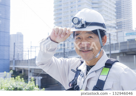 Worker wearing a full harness Worker wearing a full harness 132946046