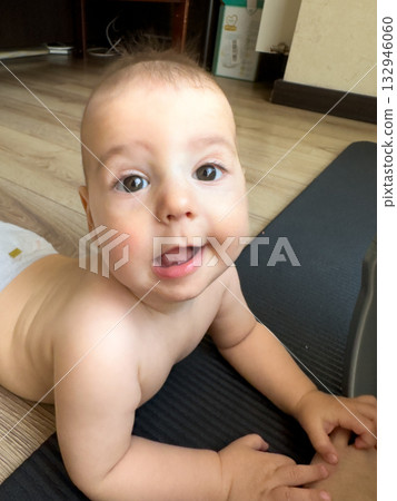 Smiling Baby on a Mat 132946060