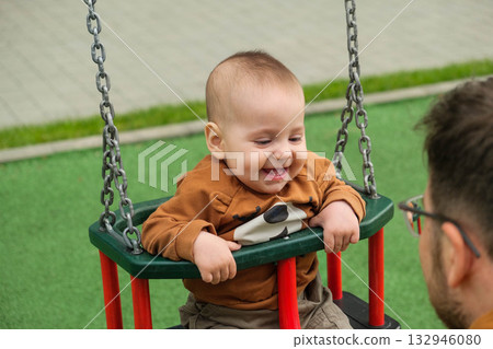 Happy Baby on Swing at Playground 132946080