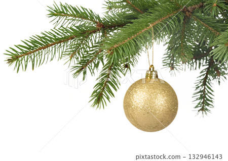 Golden christmas bauble ornament hanging from green pine branch, showcasing classic holiday decor with focus on shiny, reflective textures and festive simplicity 132946143