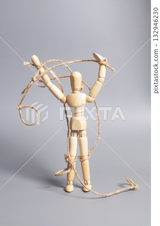 Wooden puppet with strings on gray background. Concept of emotional manipulation,dictatorship and control 132946230