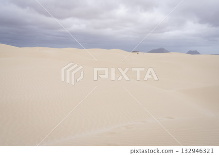 Sand dunes in Viana desert and background mountains 132946321