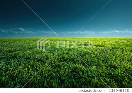Green, lush grass under a blue sky. A large, open field of grass without bushes or trees. A peaceful and serene scene. Green, lush grass under a blue sky. A large, open field of grass without bushes or trees. A peaceful and serene scene. 132946538