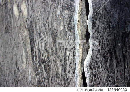 Close-up of rough rock surface with natural crack 132946630