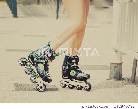 Woman legs wearing roller skates 132946782