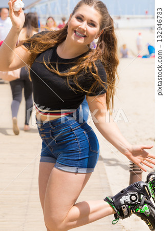 Roller skate woman eating ice cream Roller skate woman eating ice cream 132946783