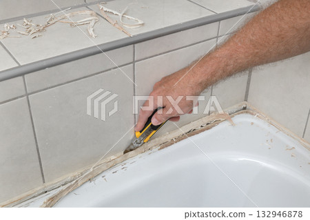 Bathroom renovation, old silicone removal Bathroom renovation, old silicone removal 132946878