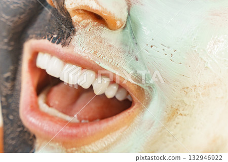 Girl black and green mud mask on face Girl black and green mud mask on face 132946922