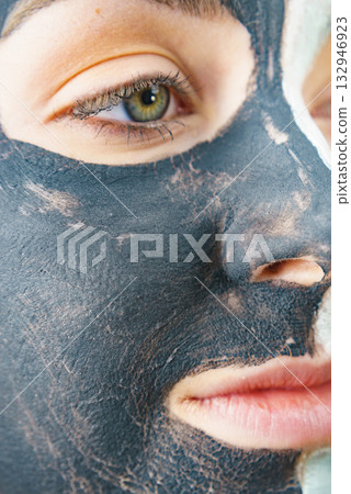 Woman with charcoal facial mask Woman with charcoal facial mask 132946923
