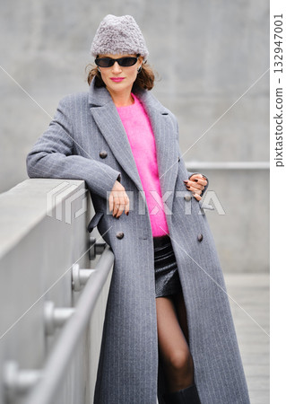 Urban street style in cool weather with bold colors and classic outerwear look 132947001
