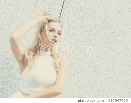 Blonde woman in city 132947023