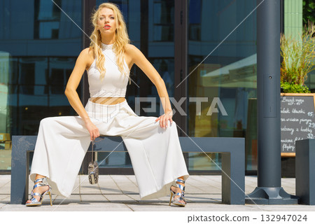 Woman wearing crop top and culottes 132947024
