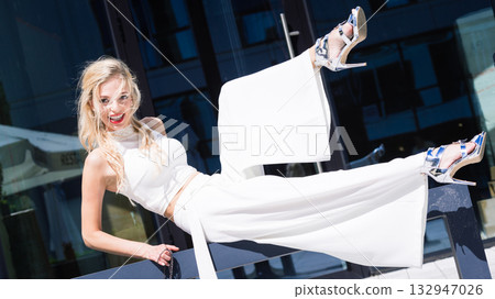 Woman wearing crop top and culottes Woman wearing crop top and culottes 132947026