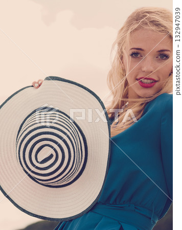 Fashion model wearing blue jumpsuit 132947039