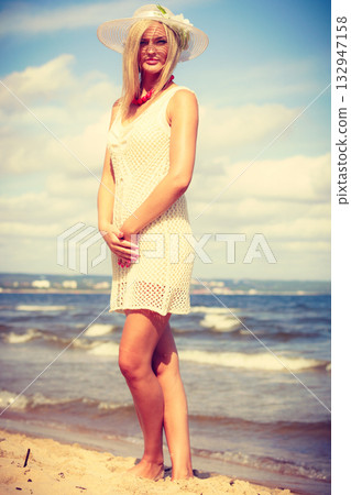 Attractive woman with white dress. Attractive woman with white dress. 132947158