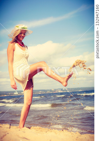 Attractive woman with white dress. 132947160