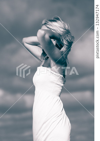 Beauty blonde woman portrait on sky background. 132947174