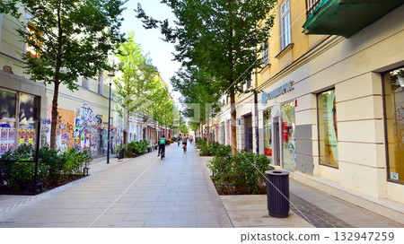 Warsaw, Poland. 21 September 2025. Chmielna in downton lined with granite slabs and planted with plants and shrubs street. City promenade during summer day. City architecture with shops and greenery. Warsaw, Poland. 21 September 2025. Chmielna in downton lined with granite slabs and planted with plants and shrubs street. City promenade during summer day. City architecture with shops and greenery. 132947259