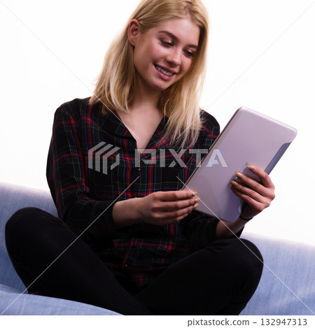 Young woman using tablet Young woman using tablet 132947313