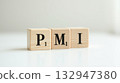wooden word PMI written in wood block 132947380