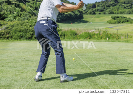 People playing at a beautiful green golf course 132947811