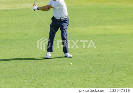 People playing at a beautiful green golf course 132947816