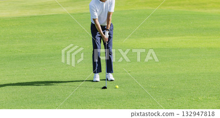 People playing at a beautiful green golf course People playing at a beautiful green golf course 132947818