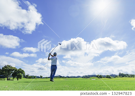People playing at a beautiful green golf course People playing at a beautiful green golf course 132947823