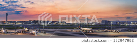 Airport and sunrise (runway, control tower) 132947998