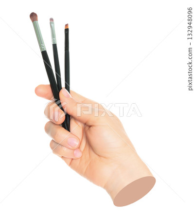 Woman hand holds black cosmetics brush, isolated on transparent background, cosmetics and visage concept. Contemporary art Woman hand holds black cosmetics brush, isolated on transparent background, cosmetics and visage concept. Contemporary art 132948096