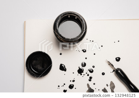 Stylish fountain pen and inkwell on paper with ink stains, flat lay. Abstract ink background set, grunge art. Black paint stroke texture on white paper. Wallpaper Stylish fountain pen and inkwell on paper with ink stains, flat lay. Abstract ink background set, grunge art. Black paint stroke texture on white paper. Wallpaper 132948125