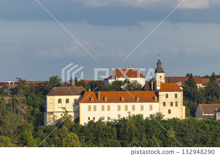 Jevisovice castle building with church spire in Czechia Jevisovice castle building with church spire in Czechia 132948290