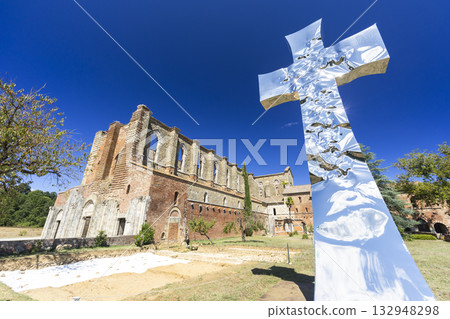 San Galgano Abbey ruins with modern mirrored cross sculpture San Galgano Abbey ruins with modern mirrored cross sculpture 132948298