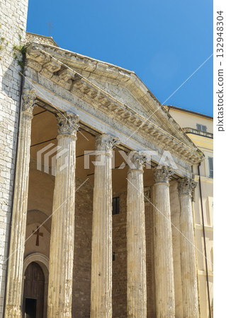 Temple of Minerva columns and pediment in Assisi, Italy 132948304