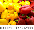 Large yellow and red bell pepper, ingredients for cooking. 132948544