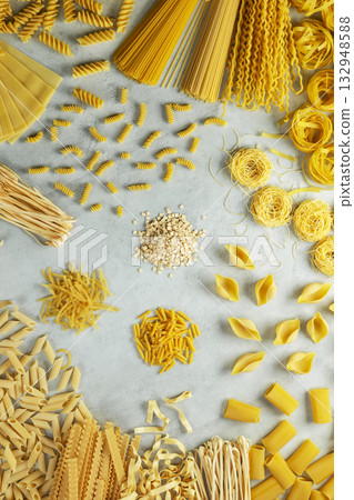 Italian pasta assortment showing various uncooked shapes Italian pasta assortment showing various uncooked shapes 132948588