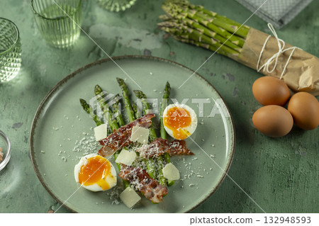 Asparagus breakfast with soft boiled egg and bacon 132948593