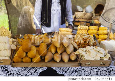 Czech market stall offering traditional artisanal cheese products 132948614