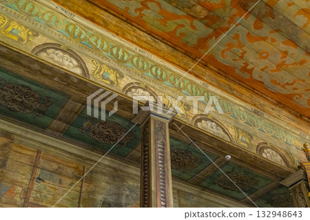 Painted wooden church interior featuring religious and floral art in Haczow, Poland Painted wooden church interior featuring religious and floral art in Haczow, Poland 132948643