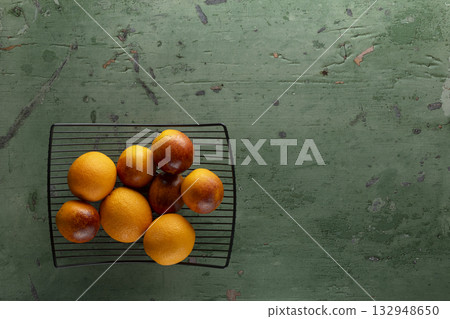 Fresh oranges and blood oranges on cooling rack 132948650