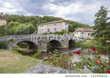 Stone bridge spanning river in Saint Jean de Cole, France 132948816