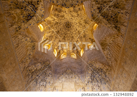 Alhambra palace intricate Islamic muqarnas ceiling architecture Alhambra palace intricate Islamic muqarnas ceiling architecture 132948892