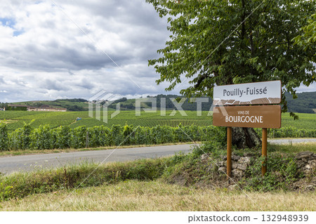 Pouilly Fuisse Vins de Bourgogne sign with rolling vineyards 132948939