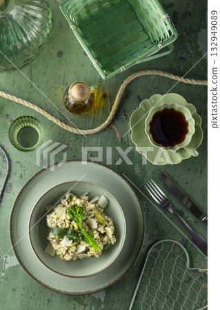 Creamy risotto with broccoli and parmesan cheese flakes Creamy risotto with broccoli and parmesan cheese flakes 132949089