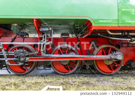 Detail of steam locomotive driving wheels and rods Detail of steam locomotive driving wheels and rods 132949112