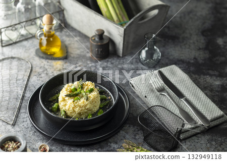 Asparagus risotto dish plating with olive oil and spices Asparagus risotto dish plating with olive oil and spices 132949118