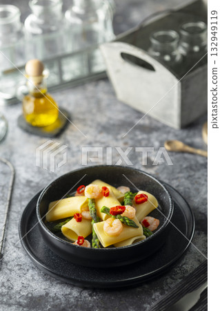 Calamarata pasta with shrimp, asparagus, and red chili Calamarata pasta with shrimp, asparagus, and red chili 132949119