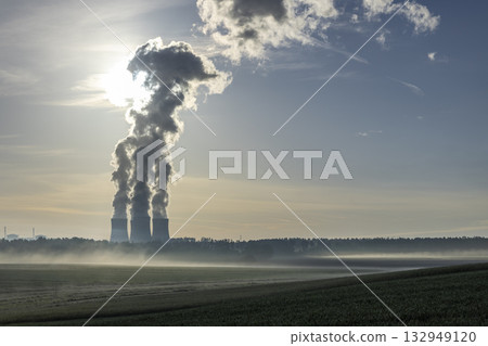 Teplice Nuclear Power Plant emitting steam over foggy fields 132949120